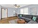 Bright living room with modern decor, wood floors, and comfortable seating at 405 N Church St, Mooresville, IN 46158
