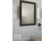 Nicely tiled bathroom wall with vanity mirror, sconces, towel ring and sink at 416 W 21St St, Anderson, IN 46016