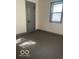 Bedroom with carpet, a window, and neutral paint with gray trim at 416 W 21St St, Anderson, IN 46016
