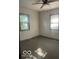 Bedroom featuring two windows, neutral paint, carpet, and a ceiling fan at 416 W 21St St, Anderson, IN 46016