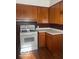 Cozy kitchen showcasing warm wood cabinets, a white range and laminate countertops at 416 W 21St St, Anderson, IN 46016