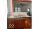 Kitchen featuring wood cabinets, stainless steel sink and countertops at 416 W 21St St, Anderson, IN 46016