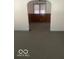 Living room featuring neutral carpeting and an archway leading to another room at 416 W 21St St, Anderson, IN 46016