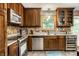 Elegant kitchen showcasing stainless steel appliances, sleek countertops, and a window above the sink at 4309 Clayburn Dr, Indianapolis, IN 46268