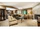 Bright living room with fireplace, plush seating, and open layout connecting to the kitchen at 4309 Clayburn Dr, Indianapolis, IN 46268
