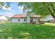 Large grassy backyard with a patio area, great for outdoor activities at 444 Austin Dr, Avon, IN 46123