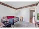 Cozy bedroom with neutral walls and carpeting, and a view into a nearby kitchen at 444 Austin Dr, Avon, IN 46123