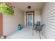 Cozy front porch featuring seating, decorative plants, and a hanging flower basket at 444 Austin Dr, Avon, IN 46123