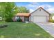 Charming ranch home featuring a manicured lawn, brick accents, and an attached two-car garage at 444 Austin Dr, Avon, IN 46123
