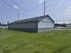 Exterior side shot of home with nice yard, and view of a parking lot at 4503 W Minnesota St, Indianapolis, IN 46241