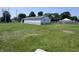 Exterior shot of home with nice yard, trees, and blue skies at 4503 W Minnesota St, Indianapolis, IN 46241