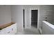 Modern bathroom with a walk-in shower and neutral-toned tiles, offering a serene space at 4999 Hummingbird Dr, Brownsburg, IN 46112