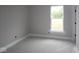 Cozy bedroom with natural light, white trim, and neutral walls, creating a peaceful retreat at 4999 Hummingbird Dr, Brownsburg, IN 46112