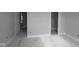 Neutral room with a door and white trim, ready for personalization at 4999 Hummingbird Dr, Brownsburg, IN 46112