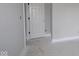 Neutral room with a door and white trim, ready for personalization at 4999 Hummingbird Dr, Brownsburg, IN 46112
