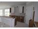 Spacious kitchen with white cabinets and a central island, ready for customization and appliances at 4999 Hummingbird Dr, Brownsburg, IN 46112