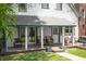 Cozy porch with seating area featuring natural lighting and beautiful greenery at 545 Fletcher Ave, Indianapolis, IN 46203