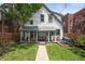 Charming two-story home featuring lush backyard, open porch, deck with picnic table and greenery at 545 Fletcher Ave, Indianapolis, IN 46203