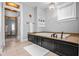 Bathroom featuring tile floor, white tub, and bright natural light at 545 Fletcher Ave, Indianapolis, IN 46203