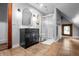 Bathroom featuring tiled floors, vanity with black cabinet, a glass shower, and natural light at 545 Fletcher Ave, Indianapolis, IN 46203
