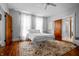 Bedroom with wood floors, and a white bed frame at 545 Fletcher Ave, Indianapolis, IN 46203