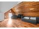 Cozy bonus room with wood planked walls and floors, seating area, and natural light at 545 Fletcher Ave, Indianapolis, IN 46203