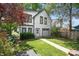 Home exterior featuring a well-manicured lawn, walkway, and an attached garage at 545 Fletcher Ave, Indianapolis, IN 46203