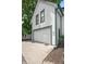 Attached garage with large door and parking area, providing convenience and curb appeal at 545 Fletcher Ave, Indianapolis, IN 46203