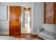 Hallway showcasing hardwood floors and a view into another room at 545 Fletcher Ave, Indianapolis, IN 46203