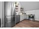 Well-equipped kitchen featuring stainless steel appliances, gray cabinets, and tiled backsplash at 545 Fletcher Ave, Indianapolis, IN 46203