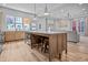 Open kitchen with island seating and view of living room at 545 Fletcher Ave, Indianapolis, IN 46203