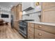 Modern kitchen with stainless steel appliances and custom cabinets at 545 Fletcher Ave, Indianapolis, IN 46203