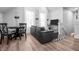 Cozy living room with a comfortable black leather sofa, dining table, and bright windows at 545 Fletcher Ave, Indianapolis, IN 46203