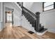 Beautiful staircase with dark wood and white accents leading to the upper level of the house at 545 Fletcher Ave, Indianapolis, IN 46203