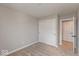 Neutral bedroom featuring carpet, a closet with bi-fold doors, and entry to another room at 6038 Windsor Dr, McCordsville, IN 46055