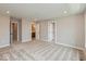 Spacious bedroom with neutral carpet and multiple doorways to closets and bathrooms at 6038 Windsor Dr, McCordsville, IN 46055