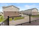 View from the deck of a two-story condo building with gray siding and brick facade at 6038 Windsor Dr, McCordsville, IN 46055