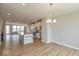 Open-concept kitchen with an island, modern appliances, and pendant lighting at 6038 Windsor Dr, McCordsville, IN 46055