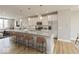 Open kitchen showcases granite countertops, stainless steel appliances, pendant lighting, and breakfast bar with seating at 6038 Windsor Dr, McCordsville, IN 46055