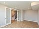 The open living space boasts recessed lighting and wood flooring, leading to the staircase at 6038 Windsor Dr, McCordsville, IN 46055
