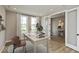 Bright home office with natural light, a neutral color scheme, and glass French doors for added privacy at 6038 Windsor Dr, McCordsville, IN 46055