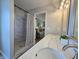Bathroom featuring double sinks, marble countertops, and a shower with a shower curtain at 6369 Kelsey Dr, Indianapolis, IN 46268