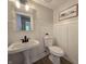 Bathroom featuring a sink with a black faucet and toilet at 6369 Kelsey Dr, Indianapolis, IN 46268