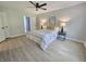 Bright bedroom features fresh paint, new vinyl floors, and a connecting bathroom at 6369 Kelsey Dr, Indianapolis, IN 46268