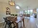 Lovely dining space with wood table, and views of the open-concept living area at 6369 Kelsey Dr, Indianapolis, IN 46268