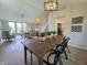 Chic dining area with wooden table, stylish chairs, and views of the spacious living room at 6369 Kelsey Dr, Indianapolis, IN 46268