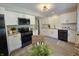 Updated kitchen with white cabinets, granite countertops, and stainless steel appliances at 6369 Kelsey Dr, Indianapolis, IN 46268