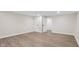 Finished basement showcasing wood-look flooring, doors, and ample space for various activities at 6838 Johnson Rd, Indianapolis, IN 46220