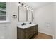 Bathroom boasts double vanity with modern fixtures and hardware, plus wood look floor at 6838 Johnson Rd, Indianapolis, IN 46220