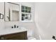 Bathroom featuring a modern vanity and white toilet and fixtures at 6838 Johnson Rd, Indianapolis, IN 46220